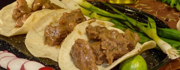 Carne Guisada Tacos plated