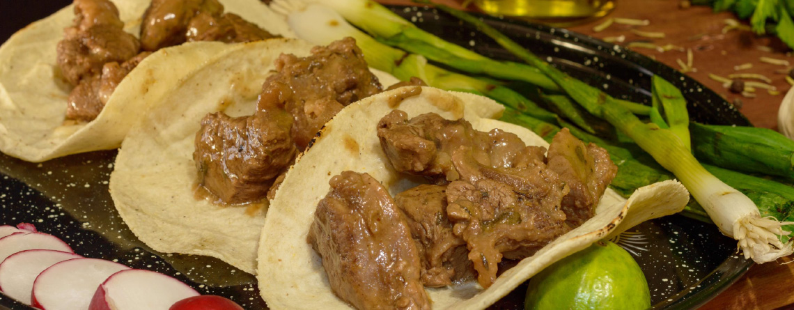 Carne Guisada Tacos plated