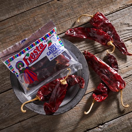 Chili Pods Cascavel in cellophane package and chili pods outside of package.